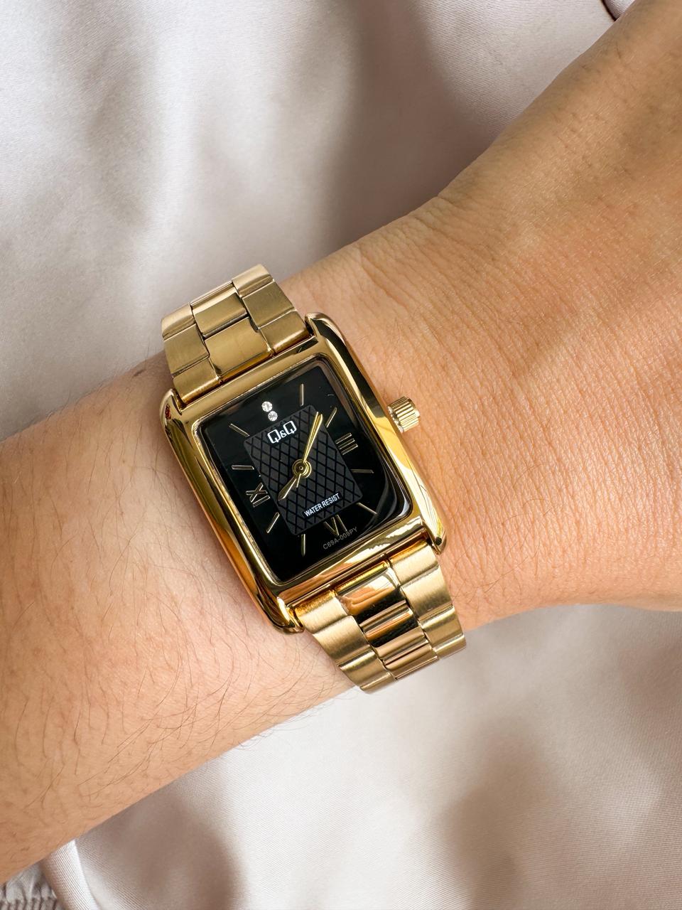 Reloj QYQ C69A  DORADO FONDO NEGRO - Imagen 1